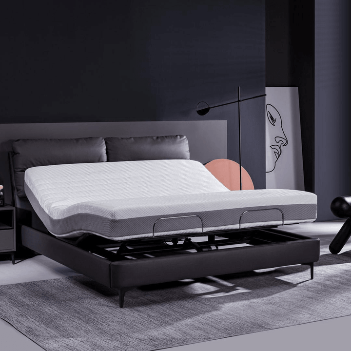 A grey milan smart leather electric bed in the living room.