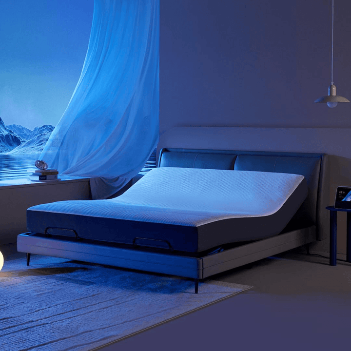 A grey and blue milan smart electric bed Pro in the bedroom