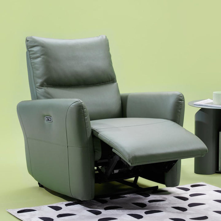 A kola smart power lounge sofa in avocado green placed in the living room